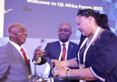 The Chancellor Covenant University Dr David Oyedepo Receiving An Award Plaque From Ms Veronica Omeni The Principal Consultant And Chairperson Qs Quacquarelli Symonds United Kingdom 2