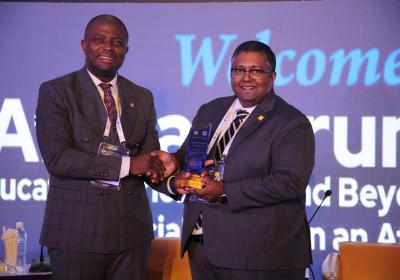 Vice Chancellor Professor Abiodun H. Adebayo Presenting An Award Plaque To Dr Ashwin Fernandes Executive Director Africa Middle East And South Asia Qs Quacquarelli Symonds United Kingdom